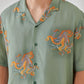 Trendy summer oversized shirt for men featuring a vibrant octopus print on a green background