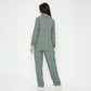 Back view of a stylish woman in a trendy two piece cord set in green, perfect for casual outings