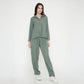 Trendy two piece cord set in green featuring a relaxed fit top and matching pants