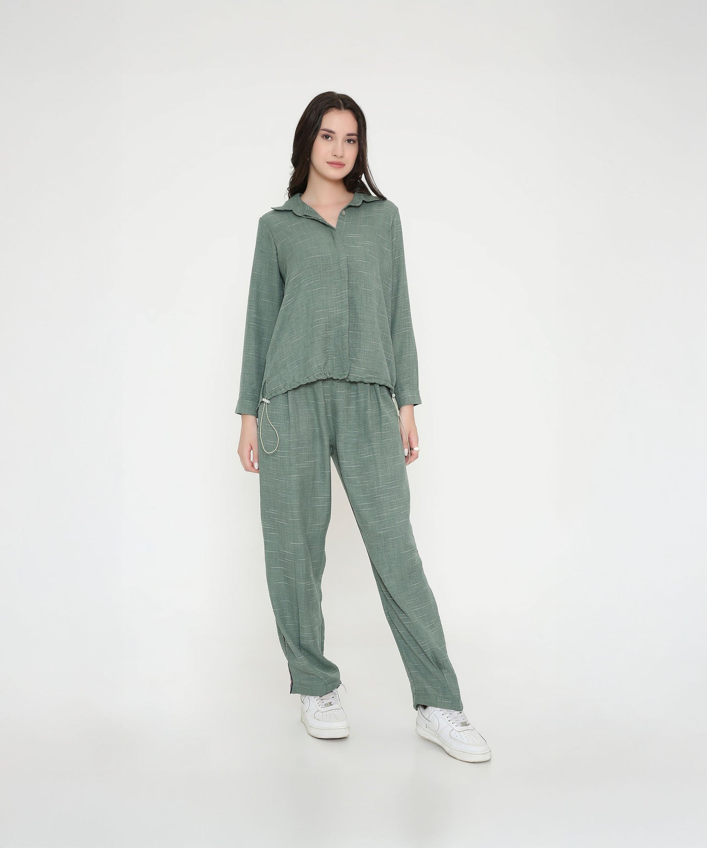 Trendy two piece cord set in green featuring a relaxed fit top and matching pants