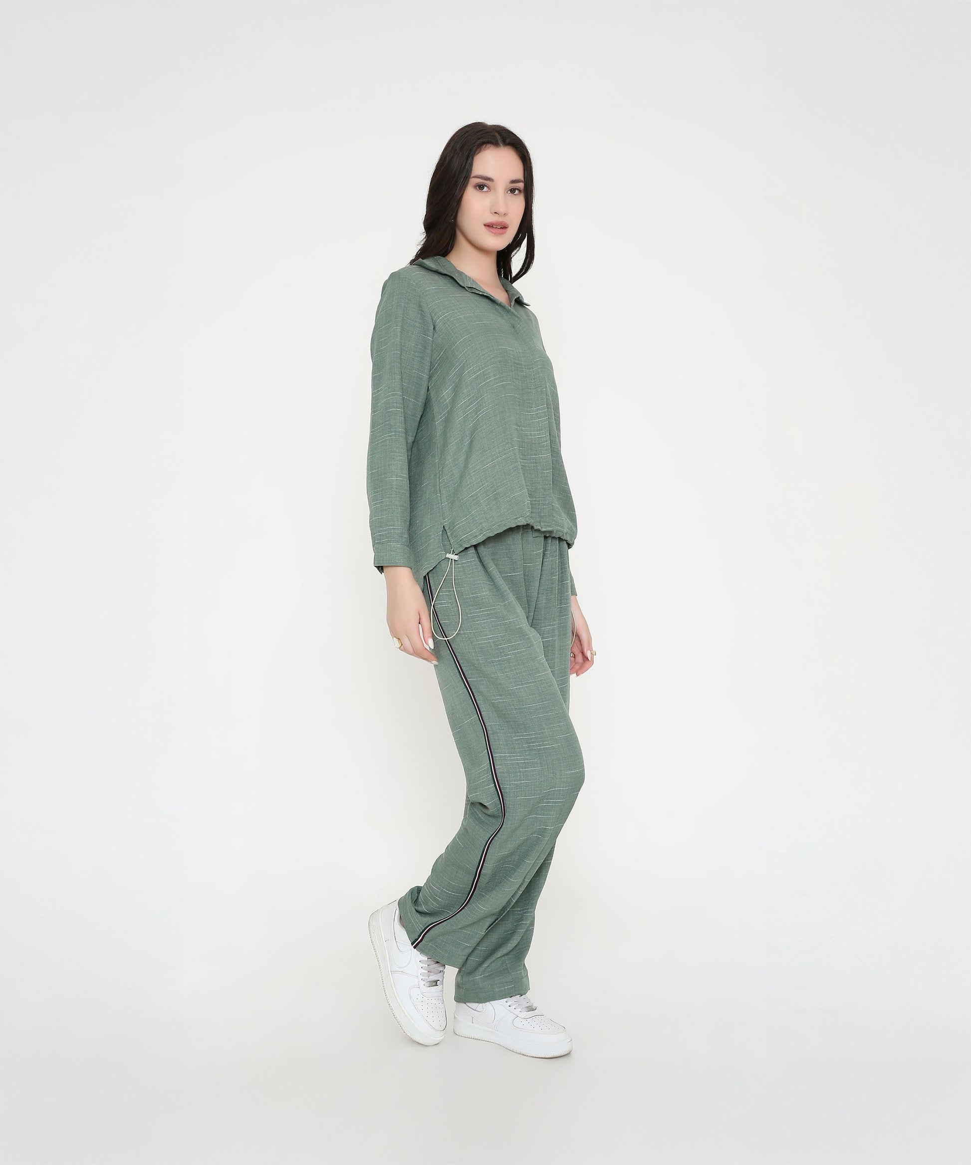 Model wearing a trendy two piece cord set in green for a stylish casual look