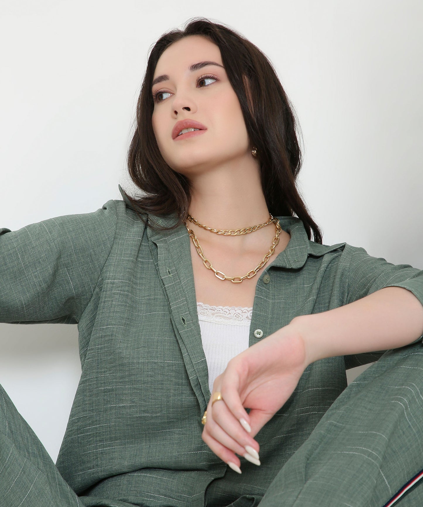 Model wearing a trendy two piece cord set in green, featuring a relaxed fit and stylish design