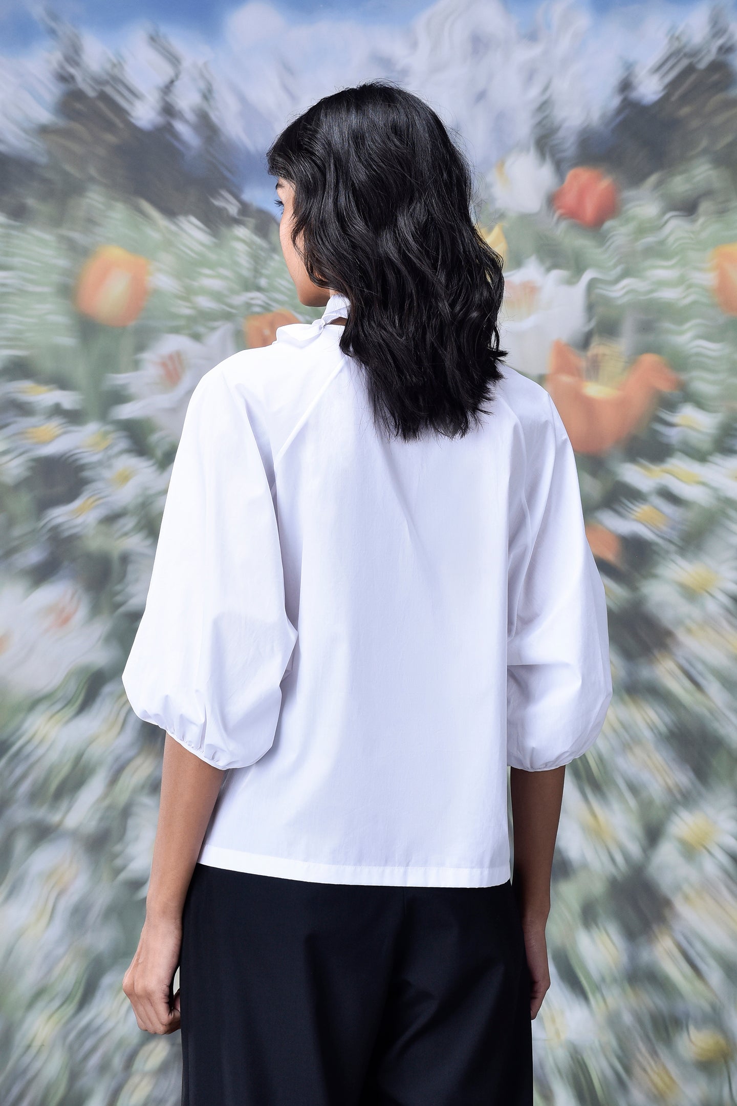 Stylera white puff sleeve cropped top back view on model showcasing trendy white tops for ladies