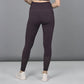 Trendy women's leggings in dark purple with stylish mesh detailing at the ankles