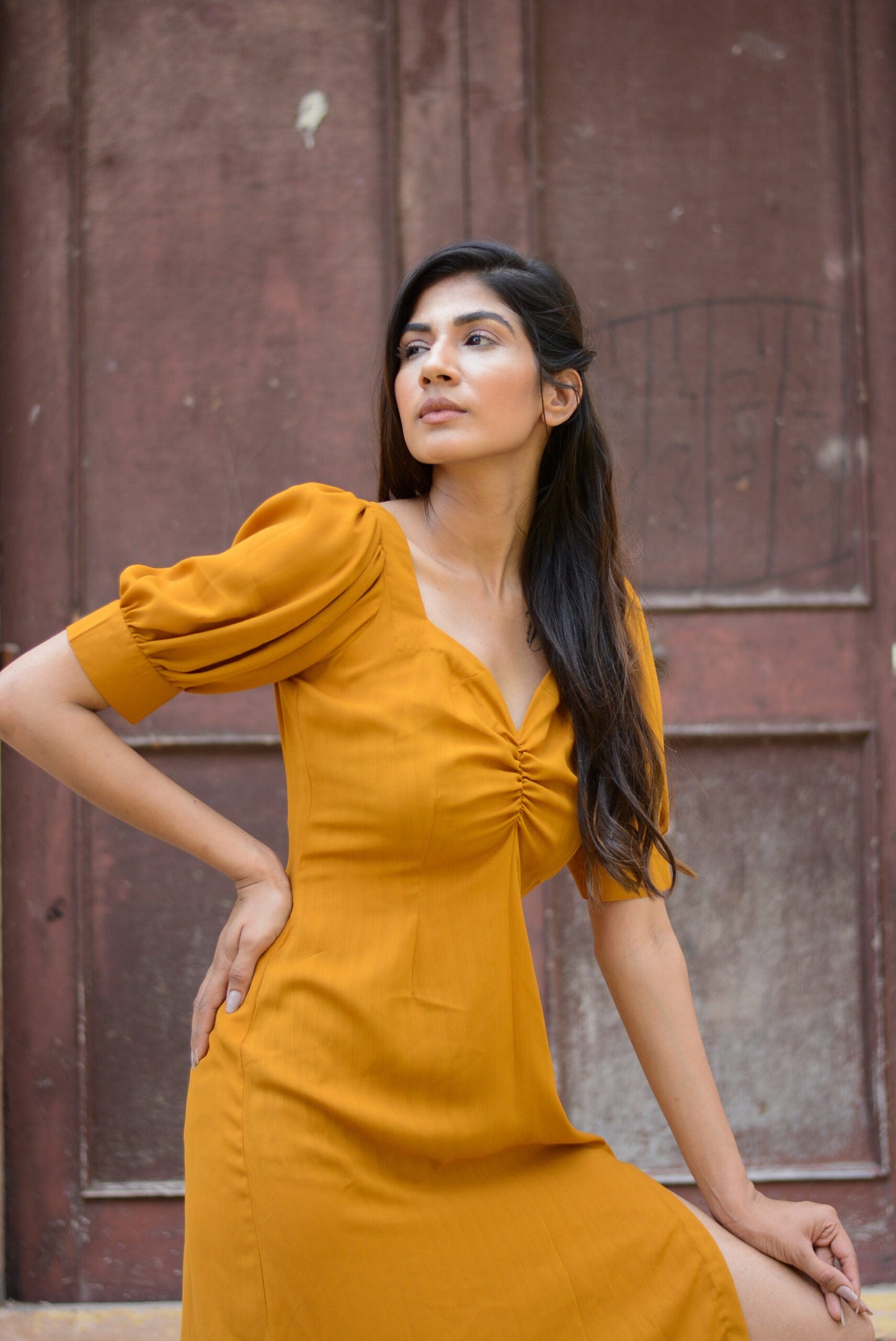 Trendy yellow slit midi dress with puff sleeves for a stylish summer look