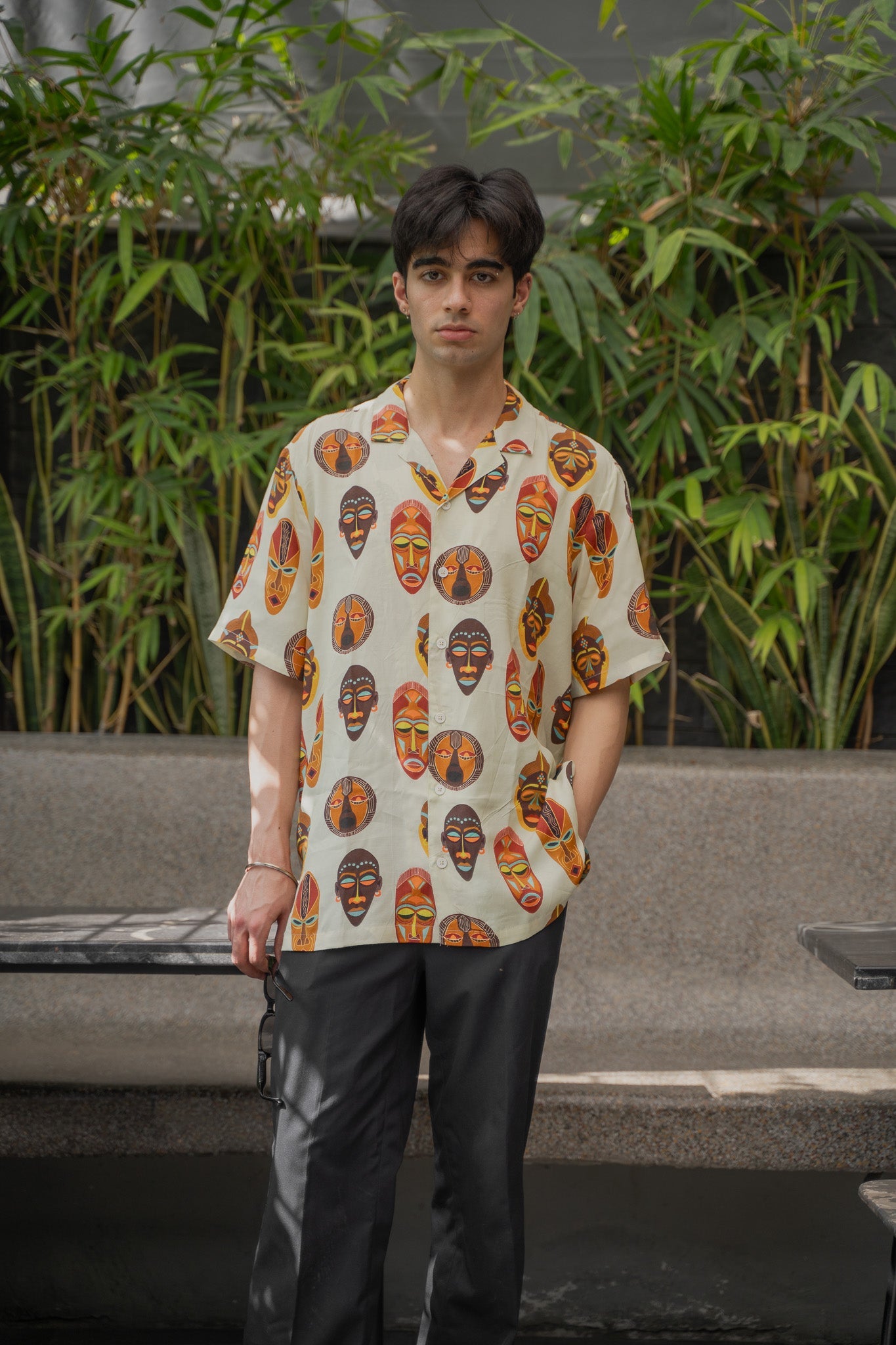 Tribal print yellow oversize shirt with unique mask designs for a bold summer look