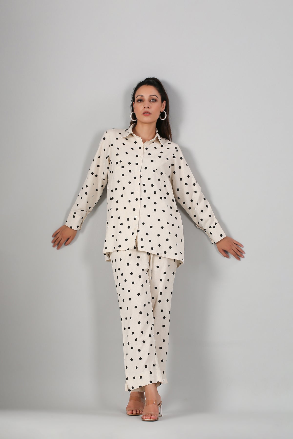 Stylera cream two piece outfit polka dots long sleeve button shirt with matching relaxed pants on model