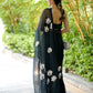 Elegant unique black saree for party wear featuring floral embroidery and a flowing sheer dupatta