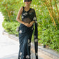 Elegant unique black saree for party wear with floral design and stylish drape