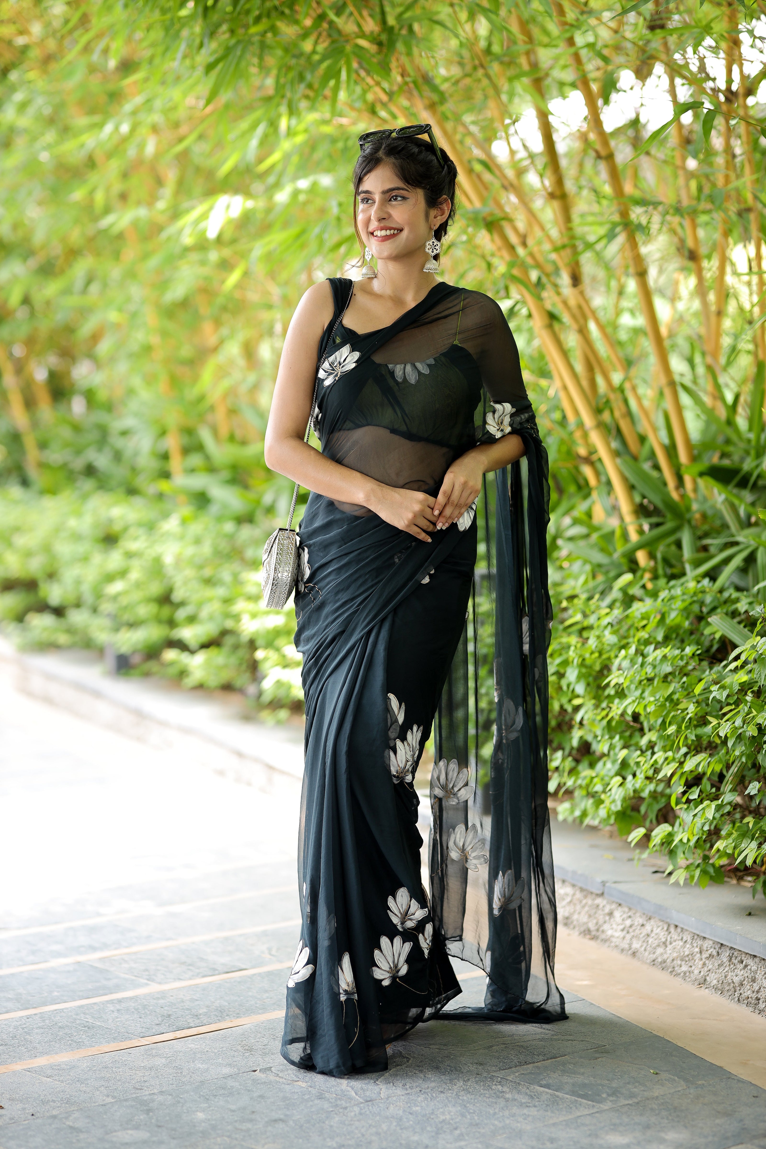 Elegant unique black saree for party wear featuring floral designs, perfect for festive occasions