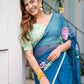 Model wearing a unique blue saree for special occasions, featuring floral designs and matching blouse