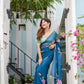 Elegant model in a unique blue saree for special occasions, featuring floral embroidery and a matching blouse.