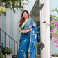 Elegant Stylera unique blue saree for special occasions with floral design and flowing fabric