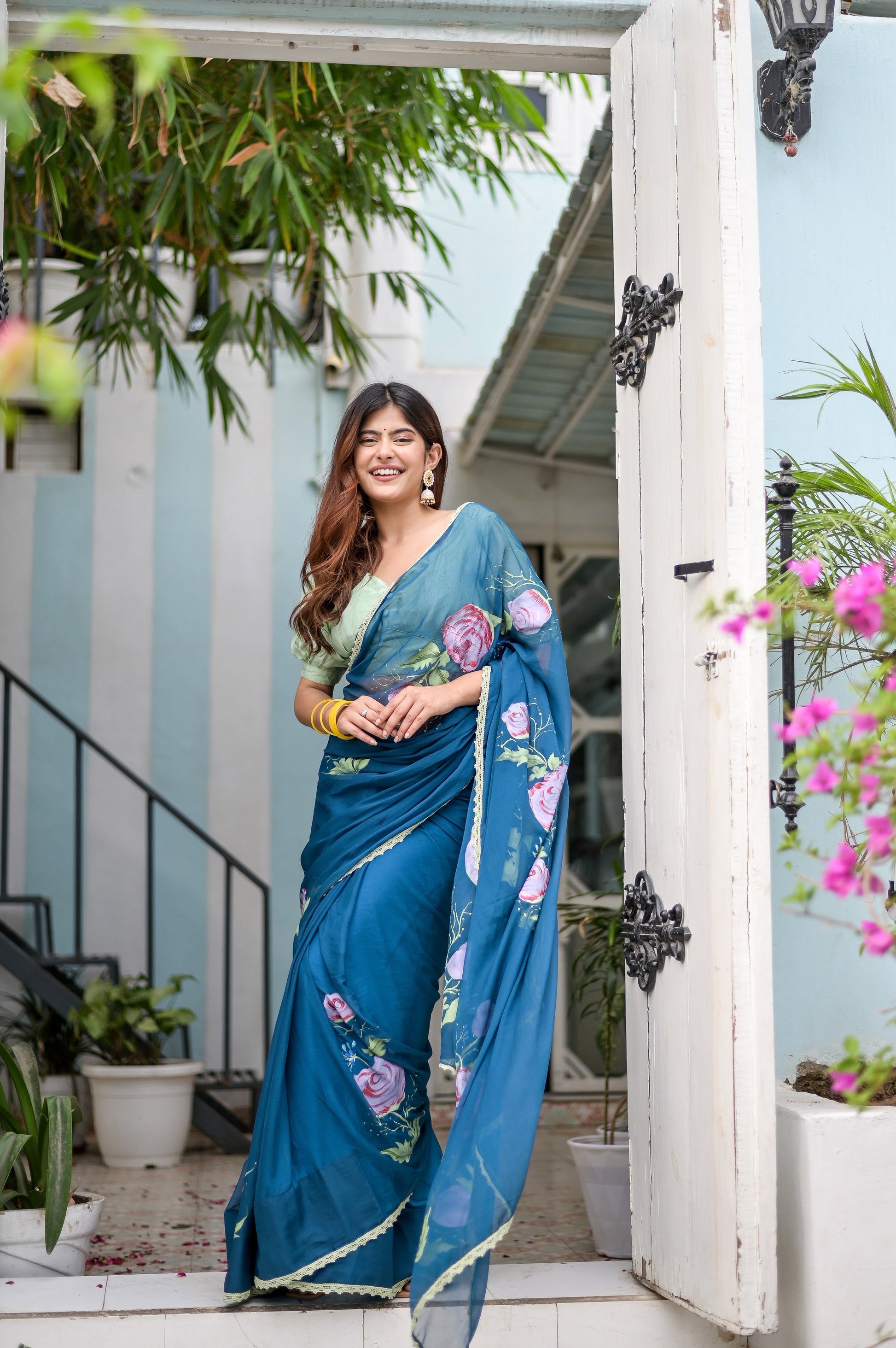 Elegant Stylera unique blue saree for special occasions with floral design and flowing fabric