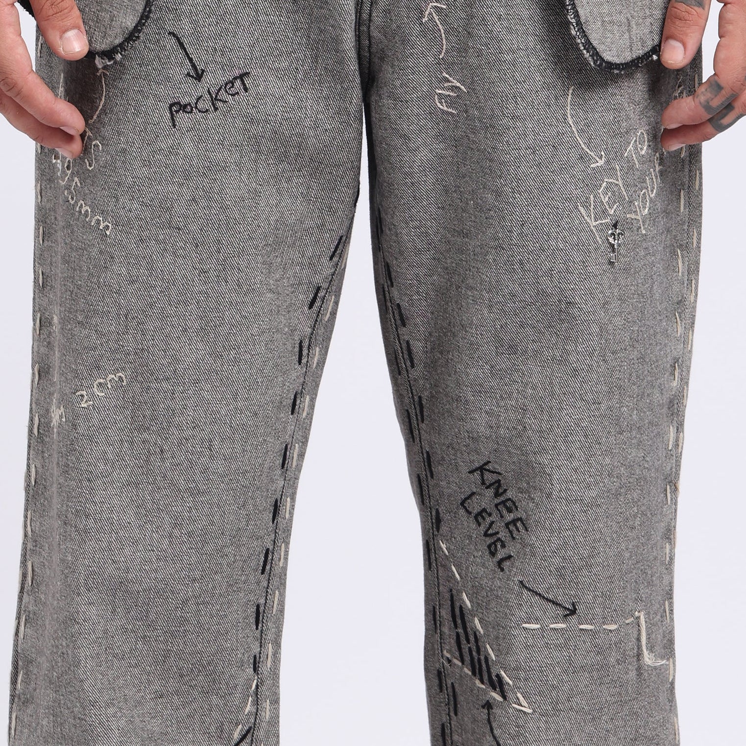 Stylera unique designer jeans for men featuring creative hand-drawn stitching details and multiple pockets