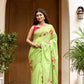 Unique designer malmal saree in green with floral embroidery, perfect for elegant occasions