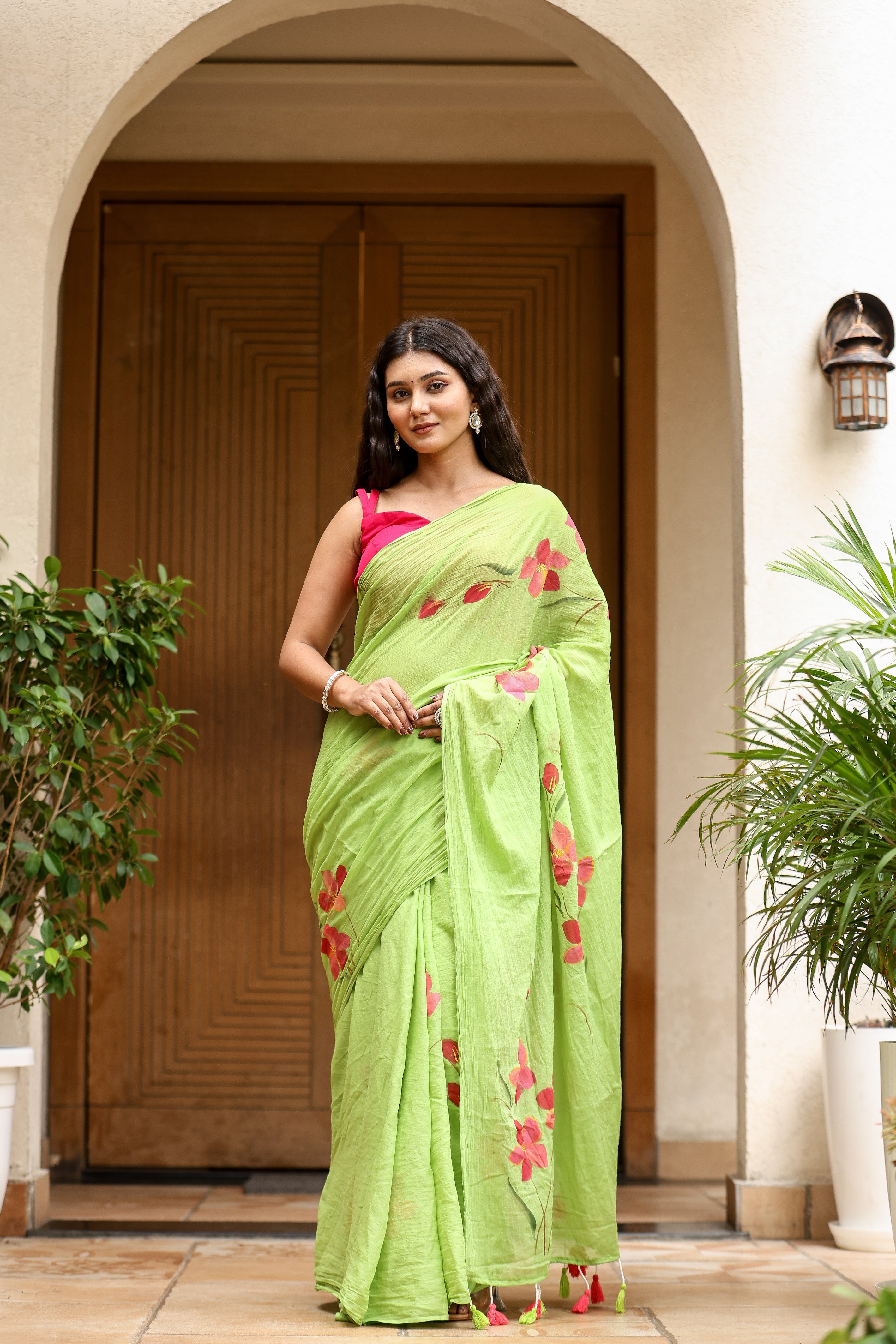 Unique designer malmal saree in green with floral embroidery, perfect for elegant occasions