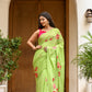 Elegant green unique designer malmal saree with floral designs, perfect for festive occasions