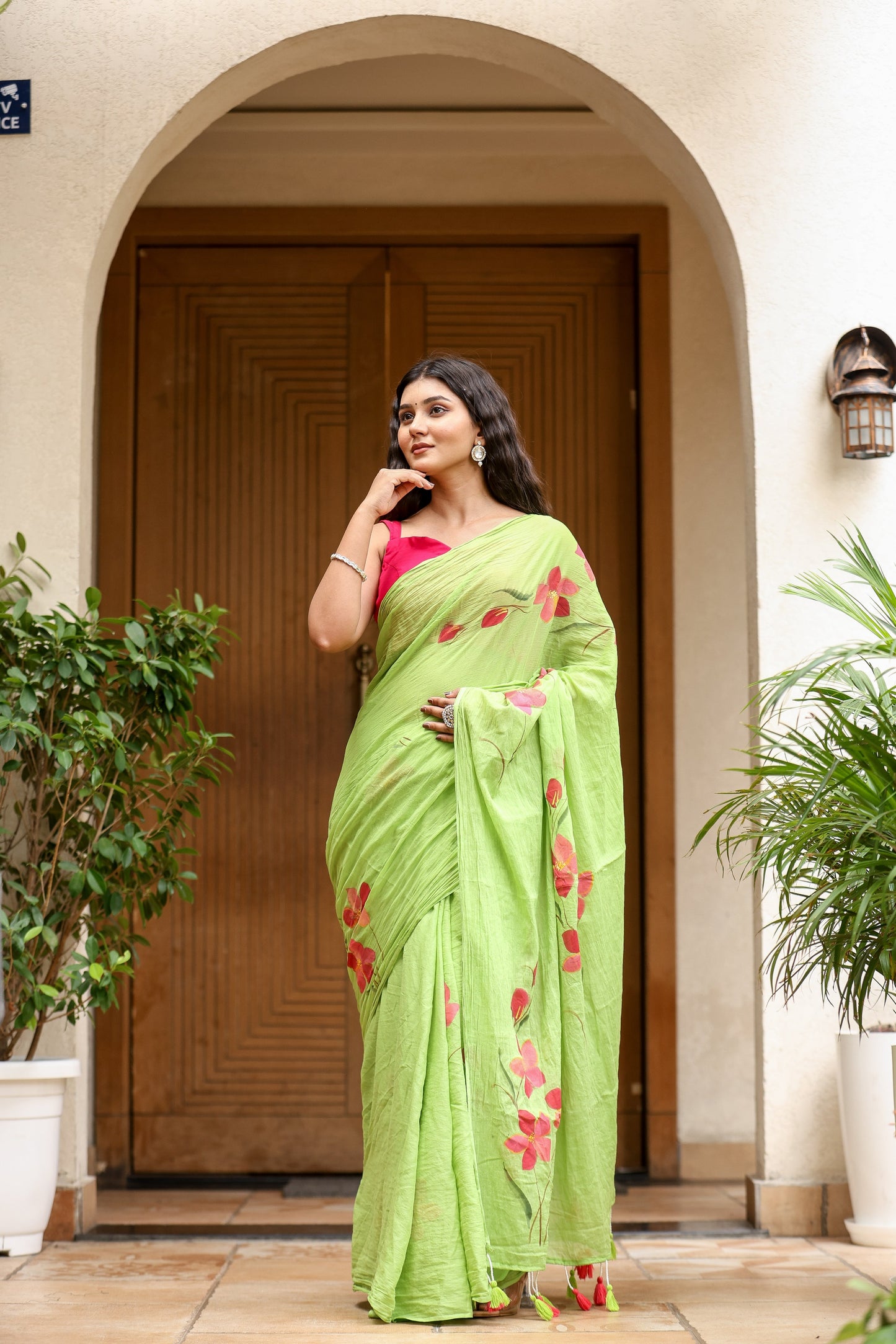 Unique designer malmal saree in vibrant green with floral embroidery for a stylish look