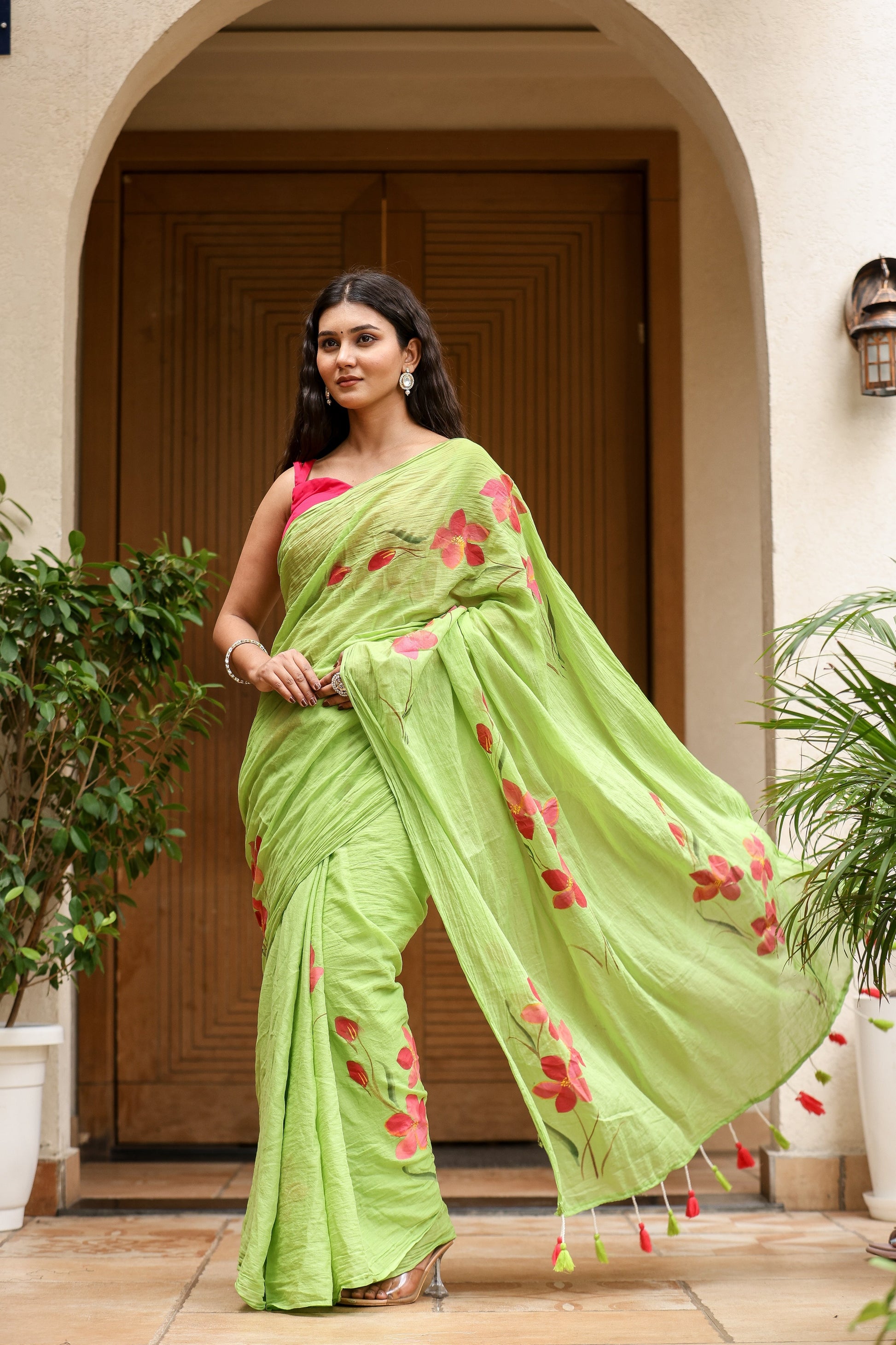 Unique designer malmal saree in green with floral embroidery, perfect for festive occasions