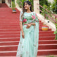 Unique designer organza saree in light green with floral embroidery, perfect for festive occasions