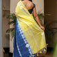 Unique designer saree for women in vibrant yellow and blue with floral accents and tassels