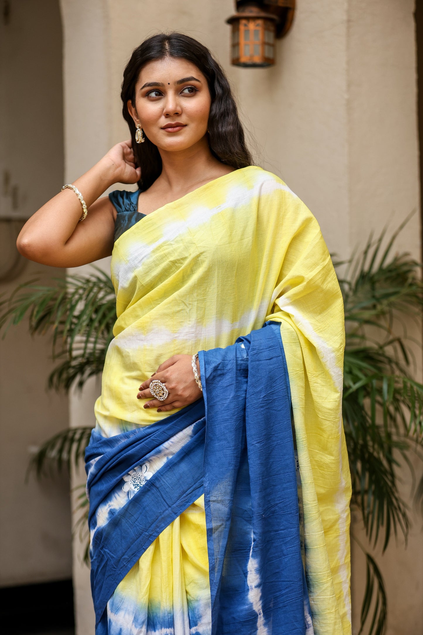 Unique designer saree for women in vibrant yellow and blue with artistic patterns for elegant style