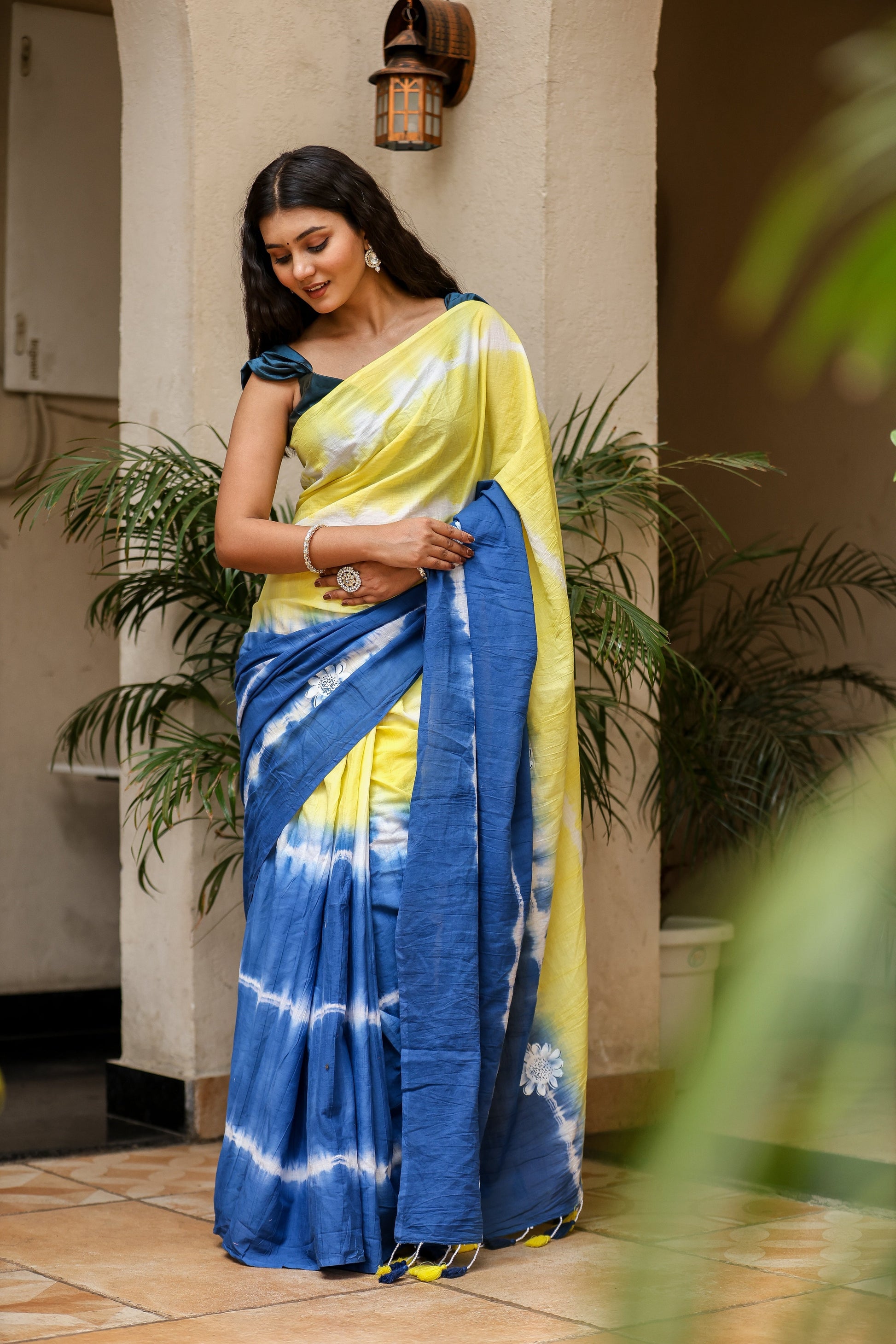 Elegant yellow and blue unique designer saree for women with tie-dye pattern, perfect for special occasions.