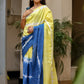 Unique designer saree for women in yellow and blue with elegant tie-dye patterns and tassel details