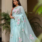 Elegant light blue unique designer sarees for parties with floral embroidery and tassel details