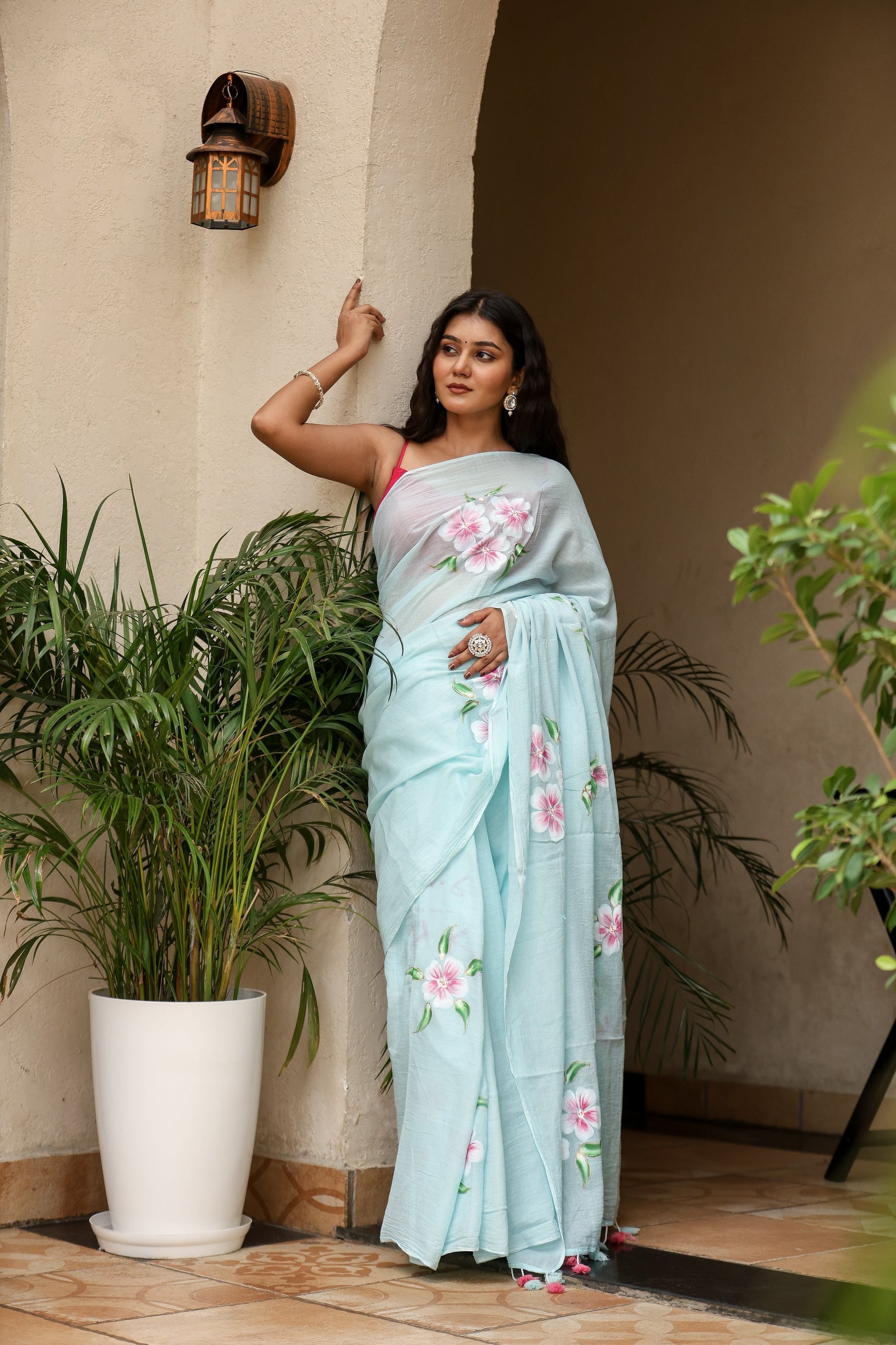 Light blue unique designer sarees for parties with floral motifs, perfect for festive occasions