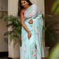 Elegant light blue unique designer sarees for parties featuring floral embroidery and a graceful drape