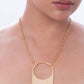 Stylera unique gold chain necklace with textured rectangular pendant and circular cutout on model