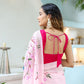 Elegant woman in a unique handpainted saree for weddings with floral patterns and a stylish blouse