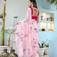 Beautiful unique handpainted saree for weddings with floral designs, worn elegantly outdoors.