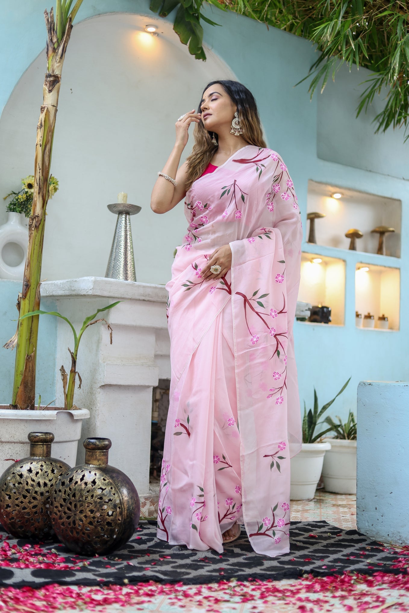 Elegant unique handpainted saree for weddings in soft pink with floral designs, perfect for festive occasions