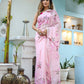 Elegant unique handpainted saree for weddings designed with floral patterns in soft pink shade
