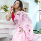 Elegant woman draped in a unique handpainted saree for weddings with pink floral designs