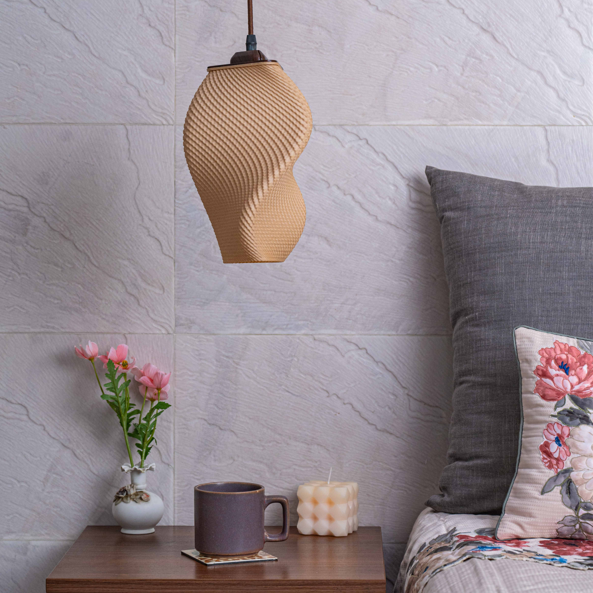 Sozori unique home decor lamps hanging above a stylish bedside table with flowers and a candle