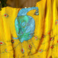 Unique Indian saree with embroidery featuring vibrant peacock designs on a yellow background
