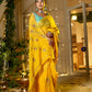 Beautiful model wearing a unique Indian saree with embroidery in vibrant yellow, styled elegantly for special occasions