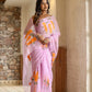 Unique party wear saree hand painted in soft pink with vibrant floral designs for elegant celebrations