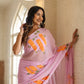 Unique party wear saree hand painted in soft pink with vibrant floral designs for festive occasions