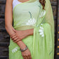 Elegant green unique saree for wedding guest adorned with floral embroidery for a stylish look