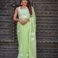 Elegant light green unique saree for wedding guest with floral design, perfect for festive occasions