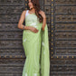 Light green unique saree for wedding guest with floral print, perfect for elegant occasions