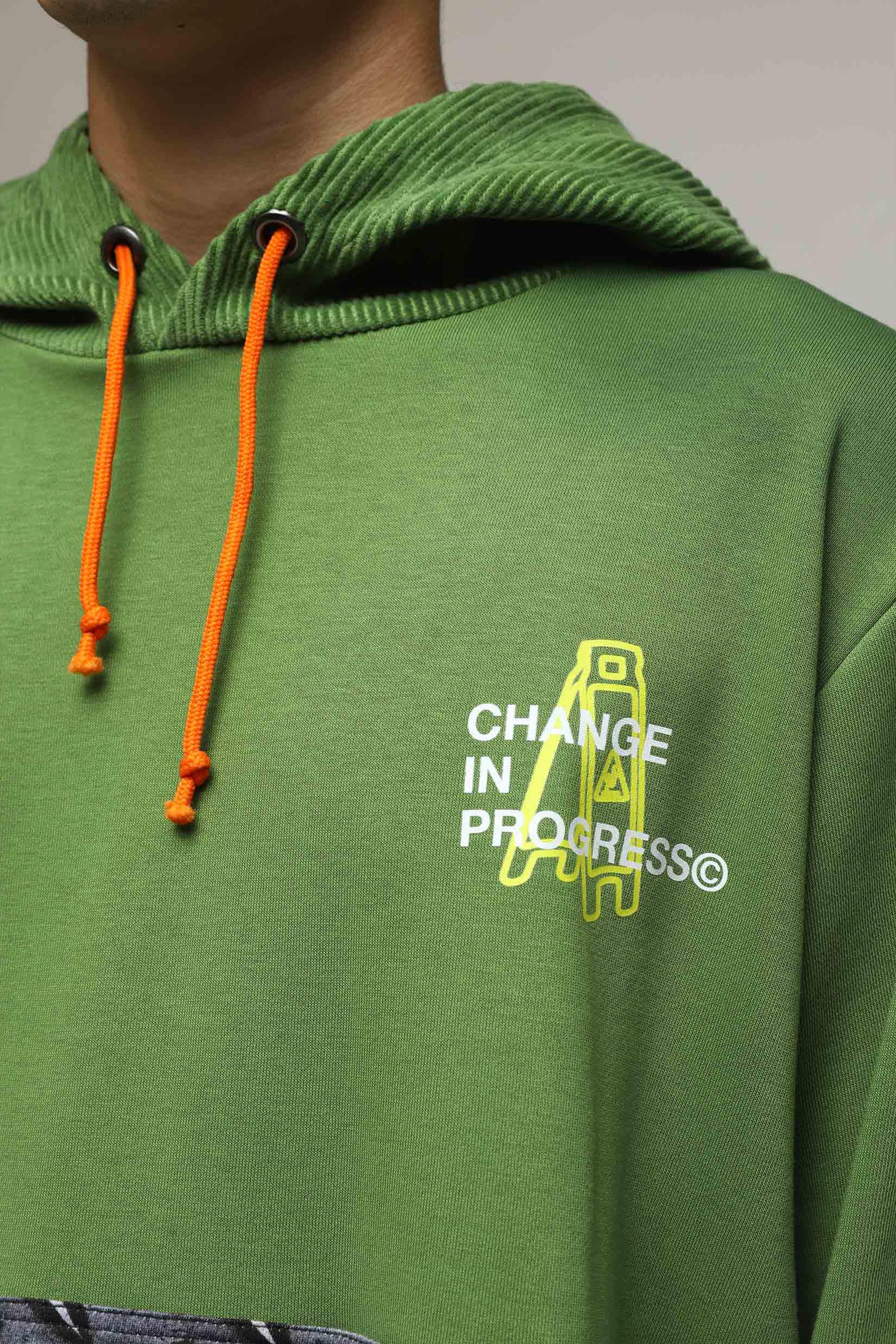 Stylera green hoodie with ribbed hood, orange drawstrings and Change in Progress ladder graphic unique streetwear hoodie