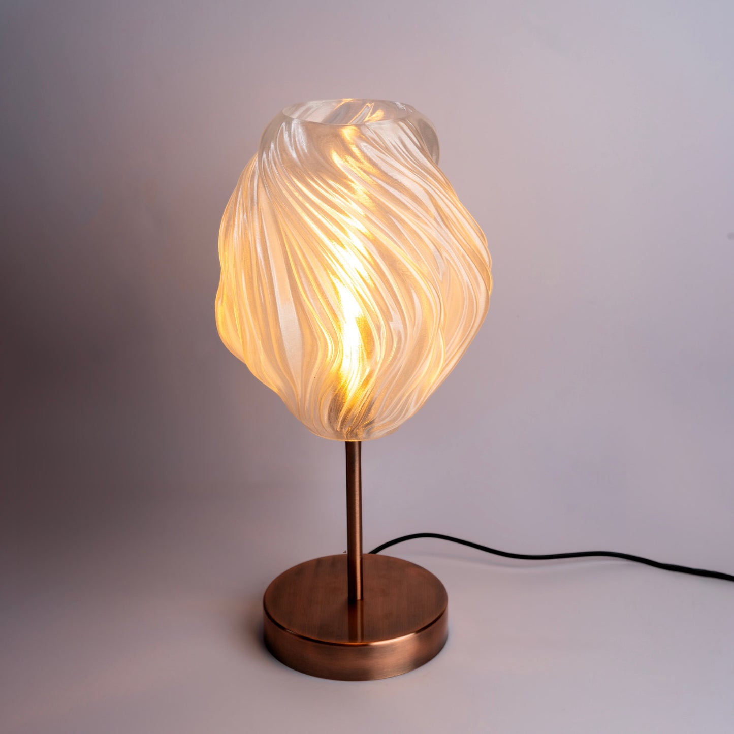 Unique wave pattern desk lamp with warm glow and modern design for stylish workspaces