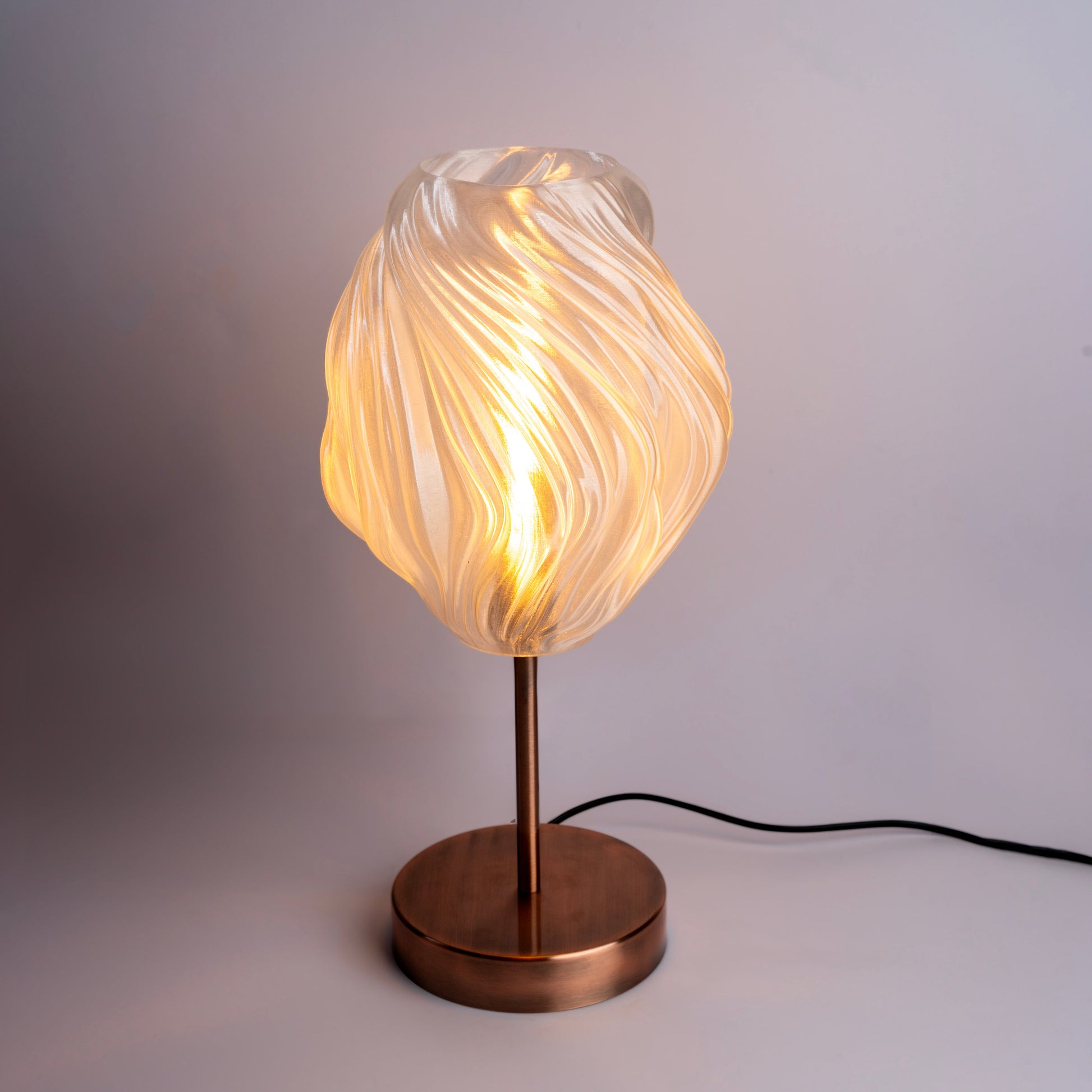 Unique wave pattern desk lamp with warm glow and modern design for stylish workspaces