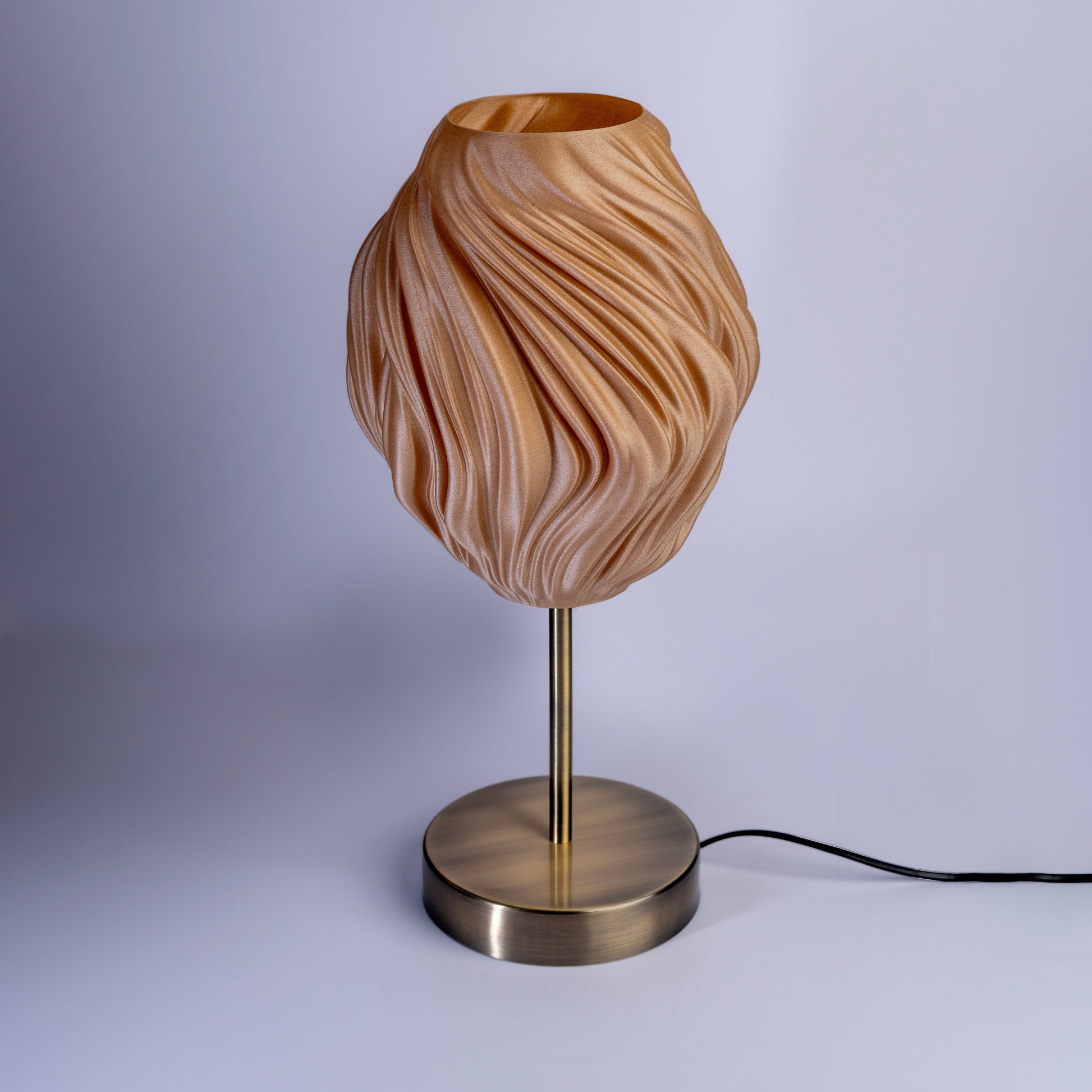 Unique wave pattern desk lamp with intricate design and modern metallic base for stylish lighting